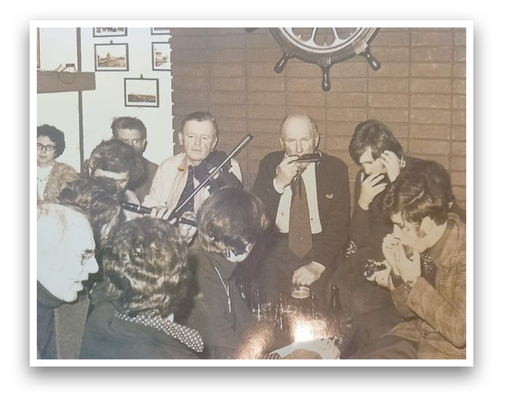 c.1976 Liam Griffin's bar Rosslare Harbour. Michael Griffin (Flute), Nick Kinsella (fiddle), Phil and John Murphy, and an unknown harmonica player.